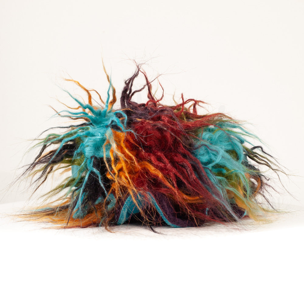 Side profile view of a cuttlepod plush toy, showcasing two-tone ruffled fins, and a cuddly, furry body.