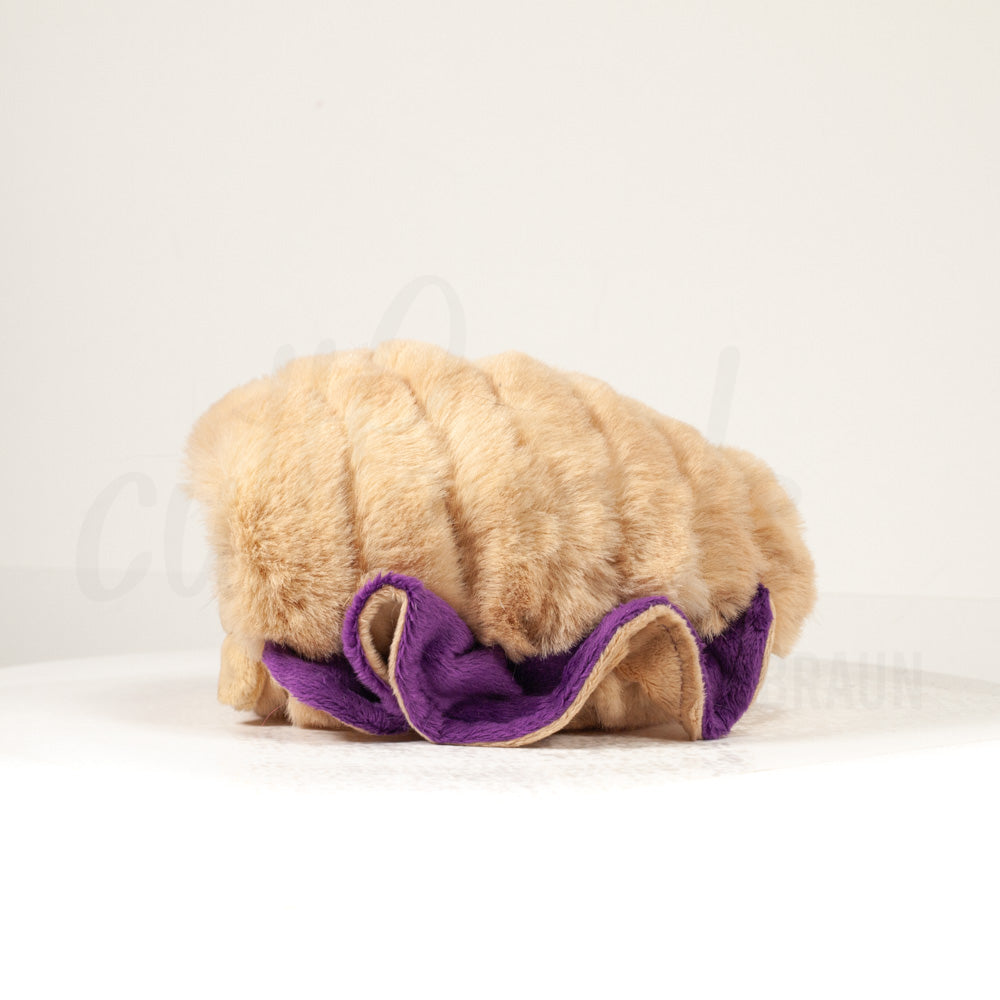 Side profile view of a cuttlepod plush toy, showcasing two-tone ruffled fins, and a cuddly, furry body.