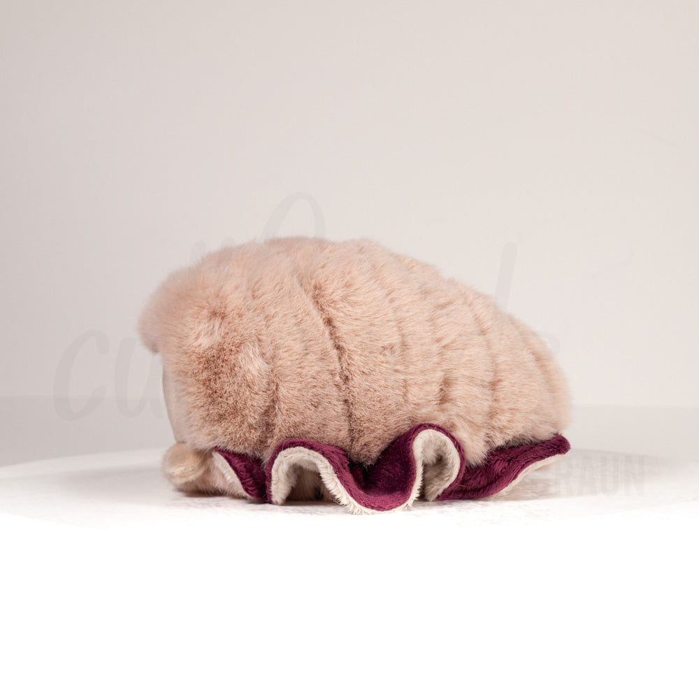 Side profile view of a cuttlepod plush toy, showcasing two-tone ruffled fins, and a cuddly, furry body.