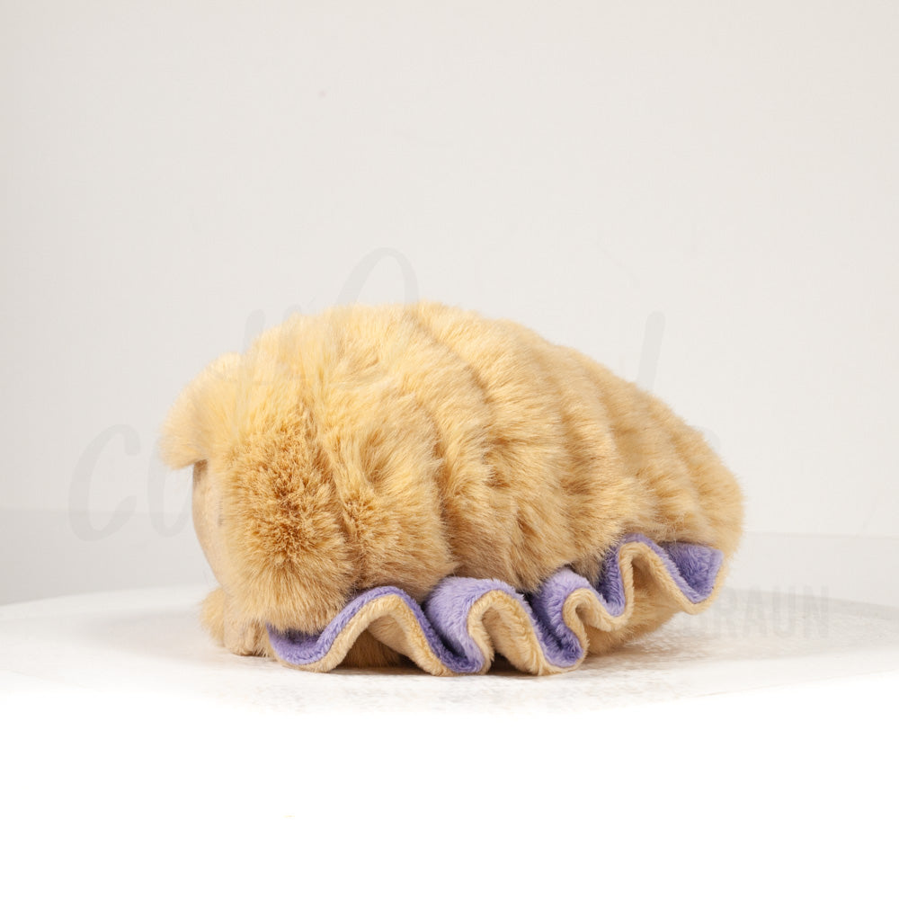 Side profile view of a cuttlepod plush toy, showcasing two-tone ruffled fins, and a cuddly, furry body.