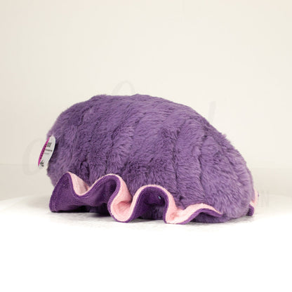 Slightly angled back view of a cuttlepod plush toy, highlighting two-tone ruffled fins, and a cuddly, furry body that comes to a soft point at the rear.