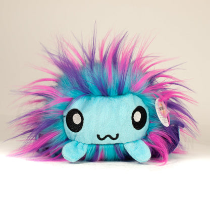 Front view of a cuttlepod plush toy, showcasing its unique form with large, cartoonish eyes, ruffled fins, and a cuddly, furry texture.