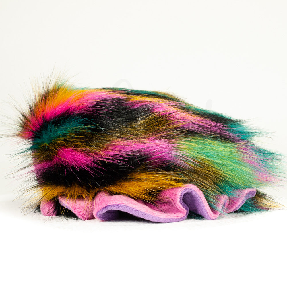 Side profile view of a cuttlepod plush toy, showcasing two-tone ruffled fins, and a cuddly, furry body.