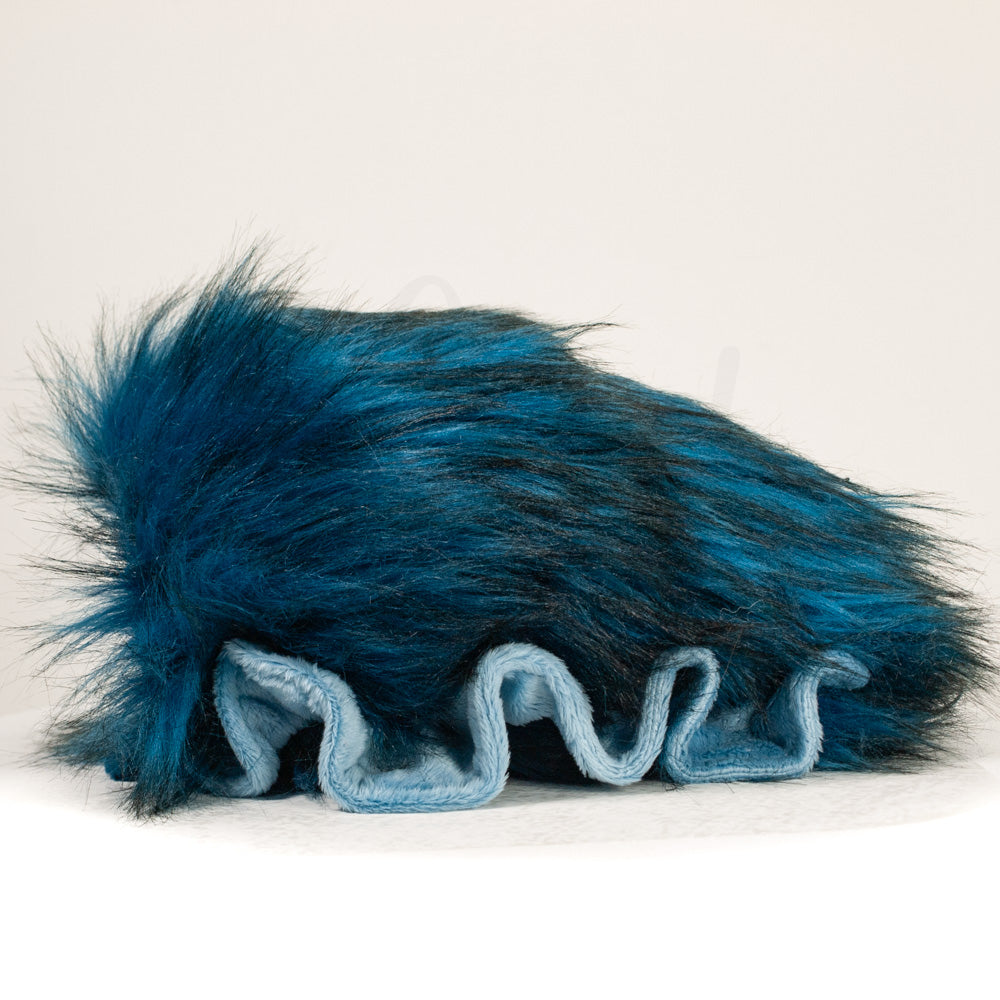 Side profile view of a cuttlepod plush toy, showcasing two-tone ruffled fins, and a cuddly, furry body.